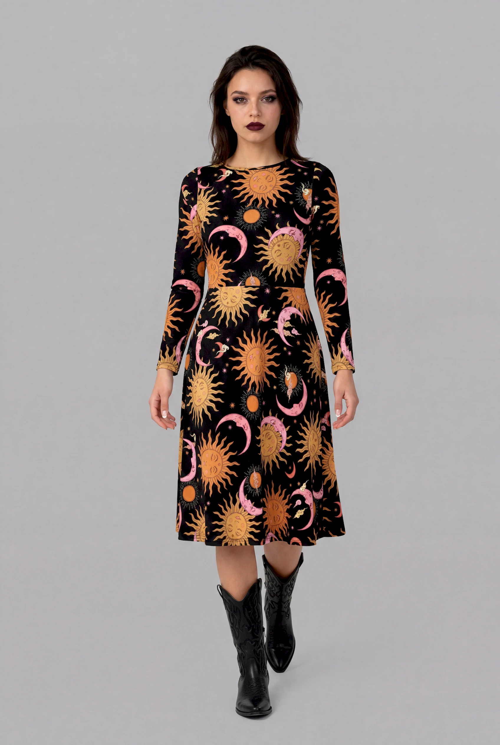 Front view of Celestial Dreams print long sleeve midi dress featuring pink moons, golden suns and star details