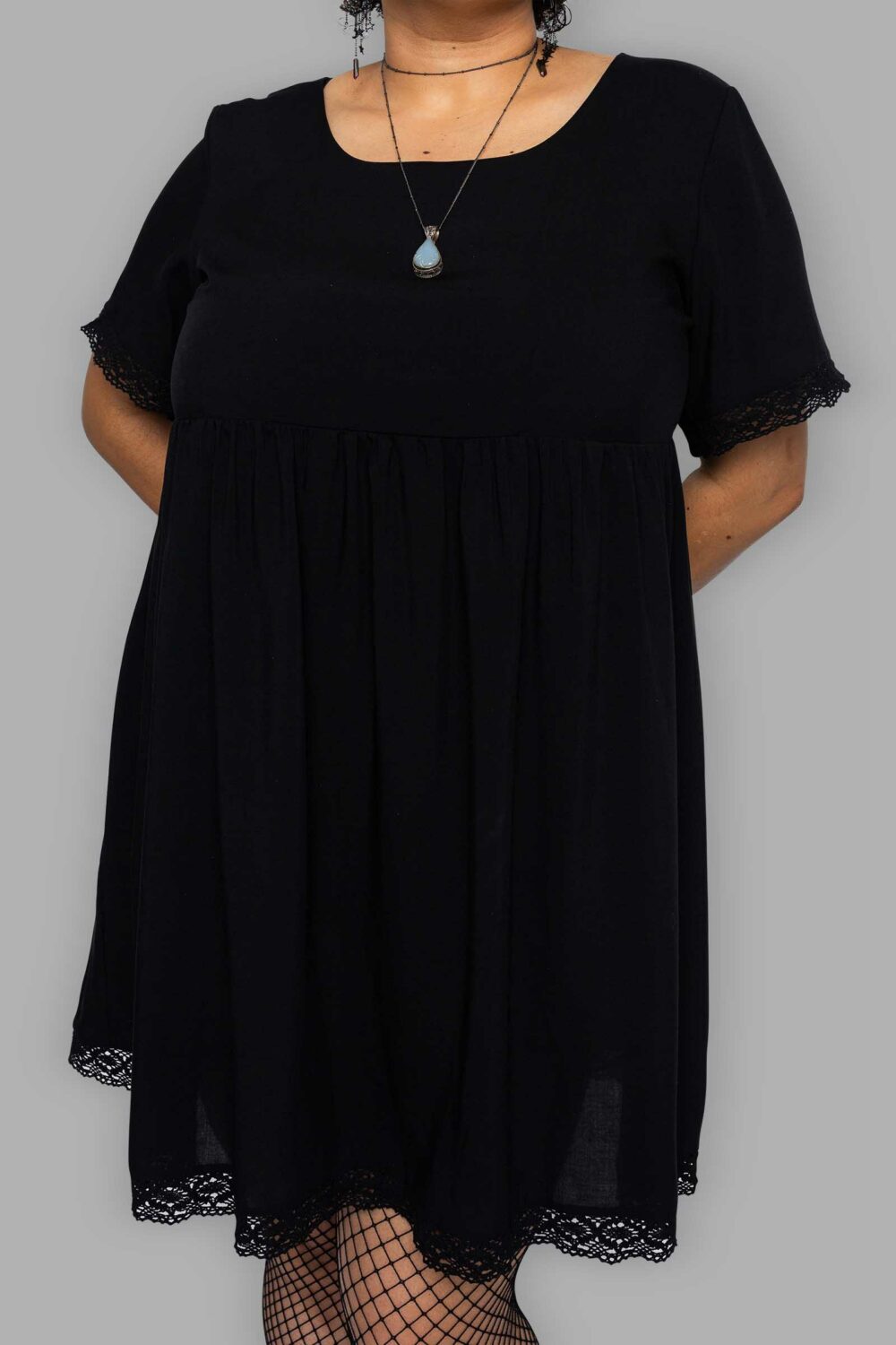 cosmic drifters black viscose short sleeved babydoll dress close plus size